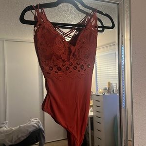 Burnt orange lacy bodysuit